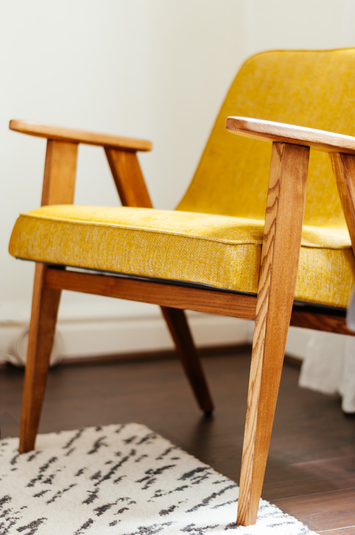 Detail of mustard mid-century armchair by 366 Concept in oak