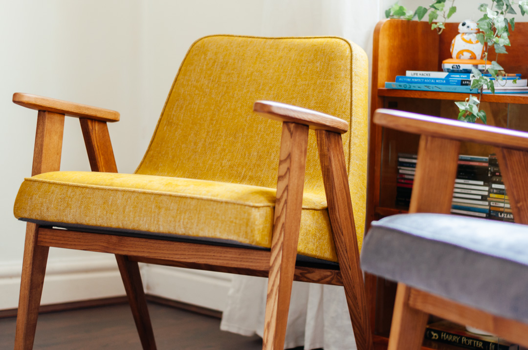 Detail of mustard yellow mid-century chair by 366 Concept in oak