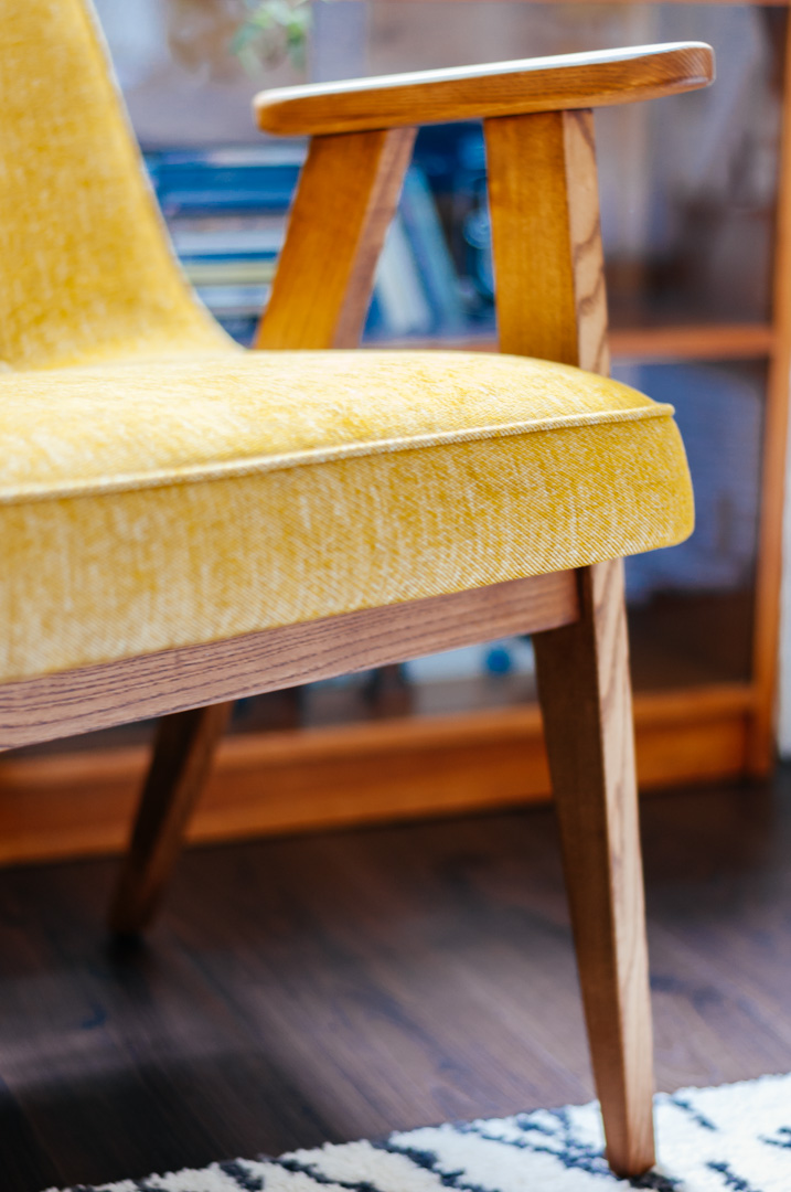Detail of yellow mid-century armchair by 366 Concept in oak