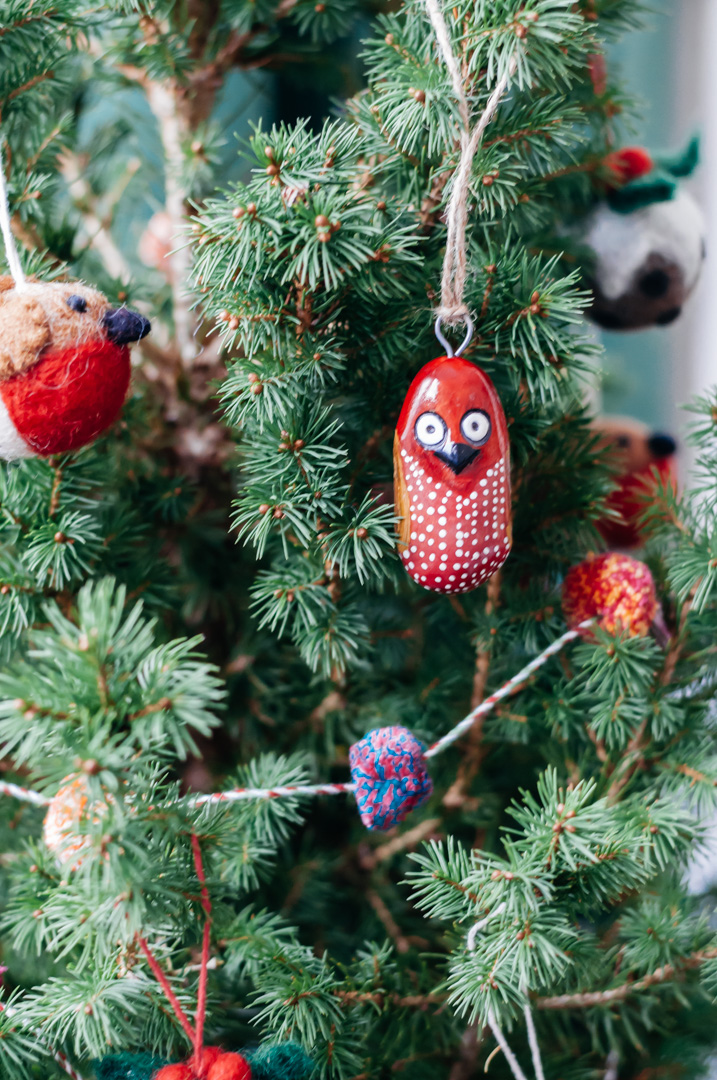 simple christmas decorations boreal abode wooden owl ornament pom pom garland